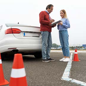 an instructor is taking dps driving test of a girl in Irving Texas