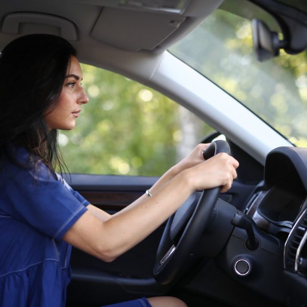 starting on the road to licensure, a novice driver undertakes Behind-The-Wheel Training in Irving at our specialized driving school, eager to master the art of driving.