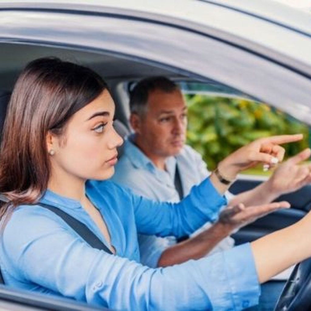 An individual of the female gender is participating in driving test in Farmers Branch alongside a proficient driving mentor within our educational facility, utilizing our most recent vehicle, which she has leased.